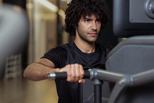 Young man on Smart Strength machine